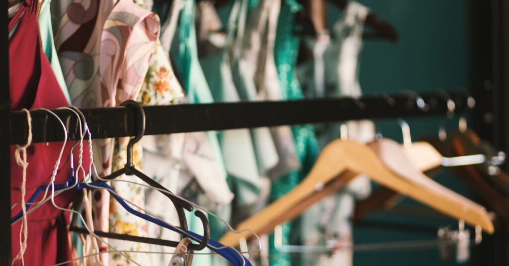 A collection of elegant dresses hanging on a clothes rack in a stylish wardrobe setup.